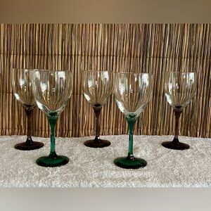 Five purple and green wine glasses